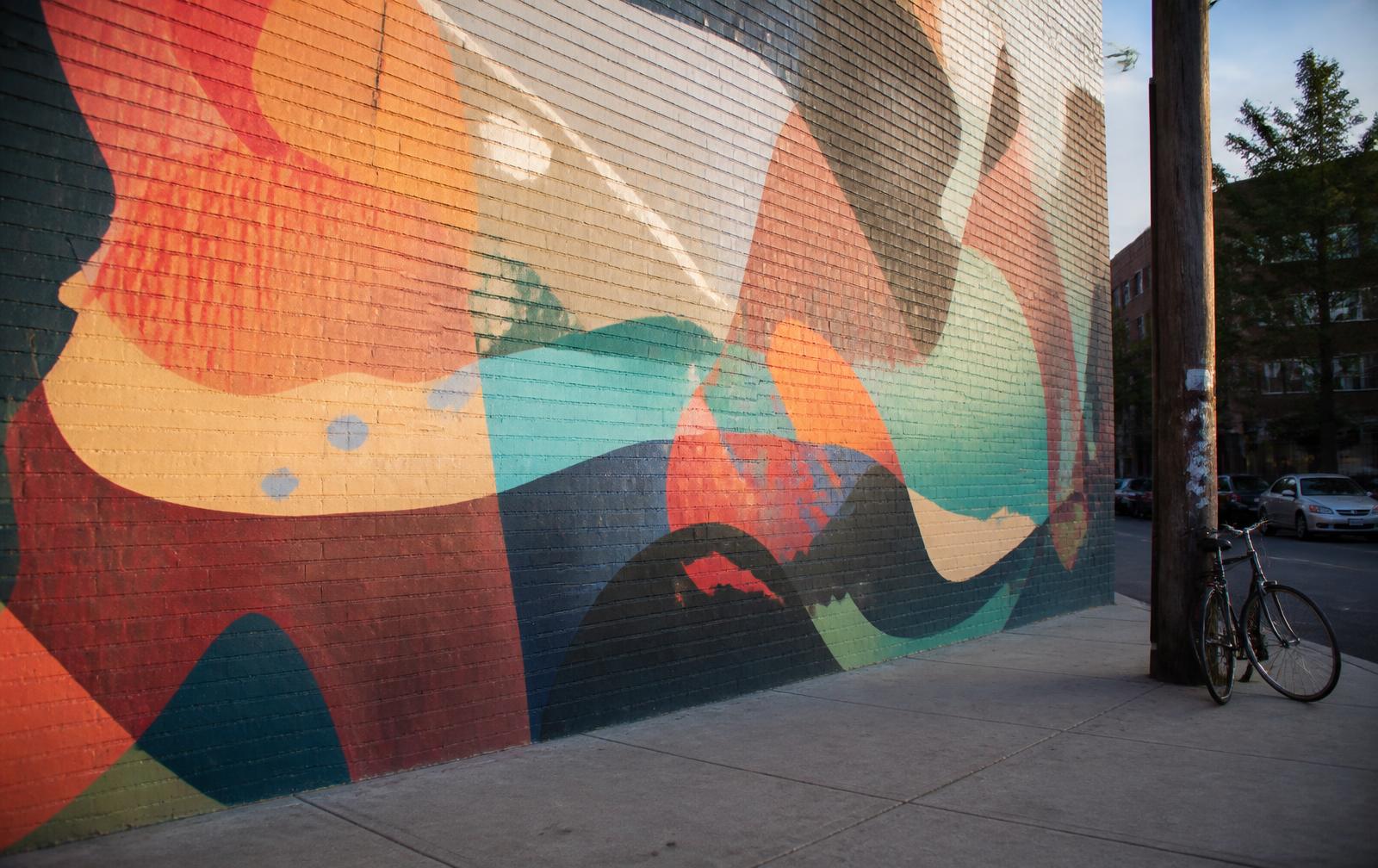 Large mural on a brick wall in Plaza Midwood